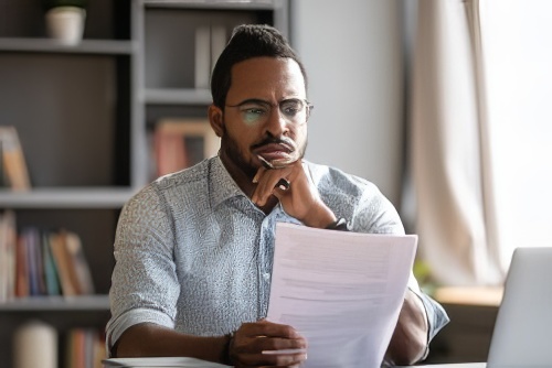Man Reviewing a Document